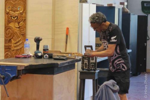 Artisan making a carviing at the Maori Arts and Crafts Institute
